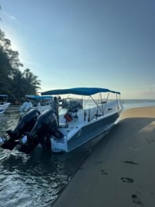 View Coral I tour boat on the beach in Uvita